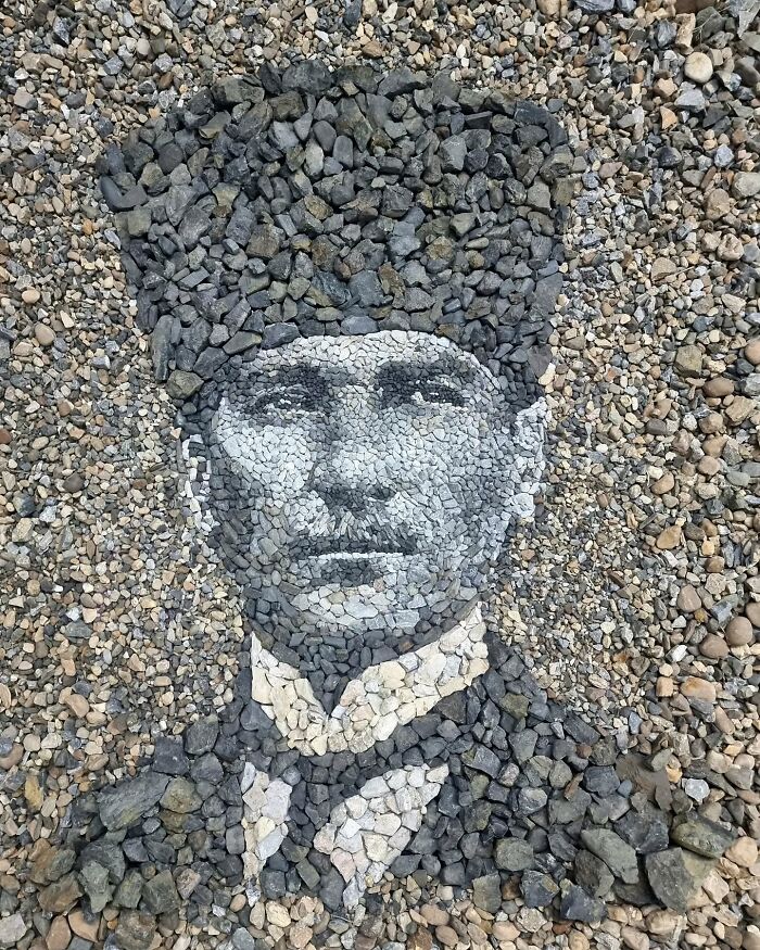 Pebble mosaic portrait by British artist, using stones to create intricate, temporary artwork.