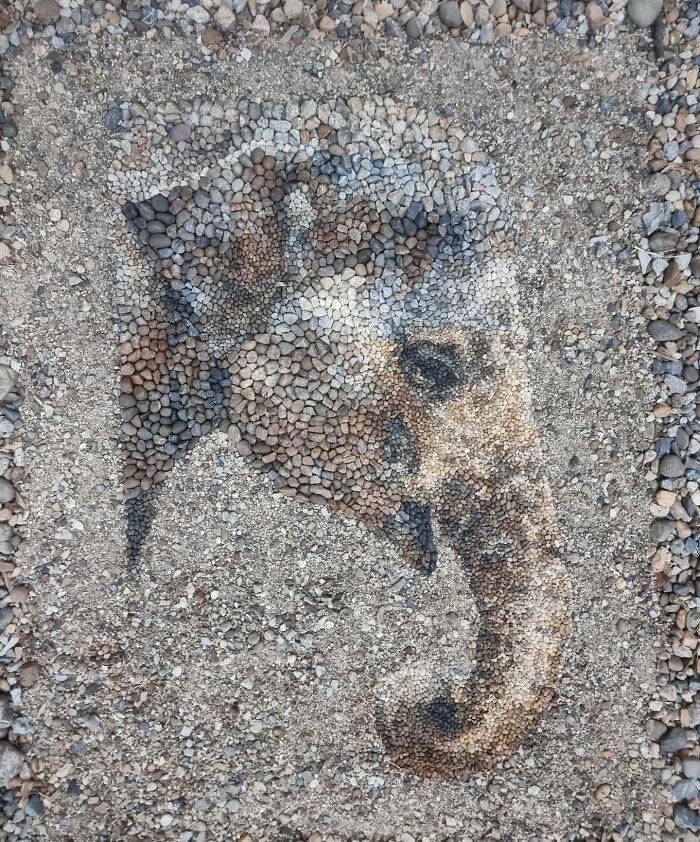 Intricate mosaic of an elephant crafted with stones and pebbles by a British artist.