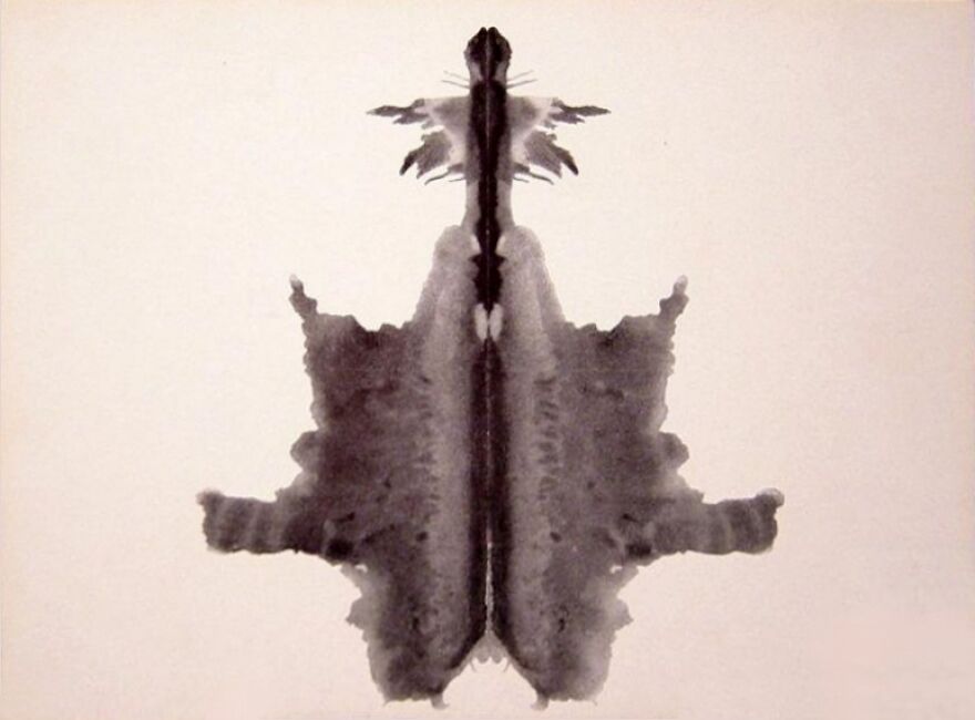 Rorschach inkblot image for viewer interpretation, inviting majority opinion comparison in a psychological poll.