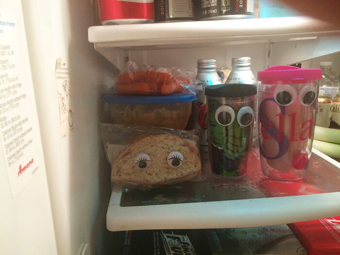Googly eyes prank on fridge items for a fun April Fools' surprise with sandwiches and drinks.
