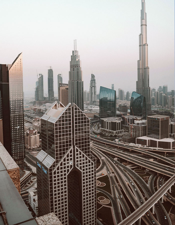 Cityscape with skyscrapers and highways, viewed from a high building, relating to model's fall incident debate.