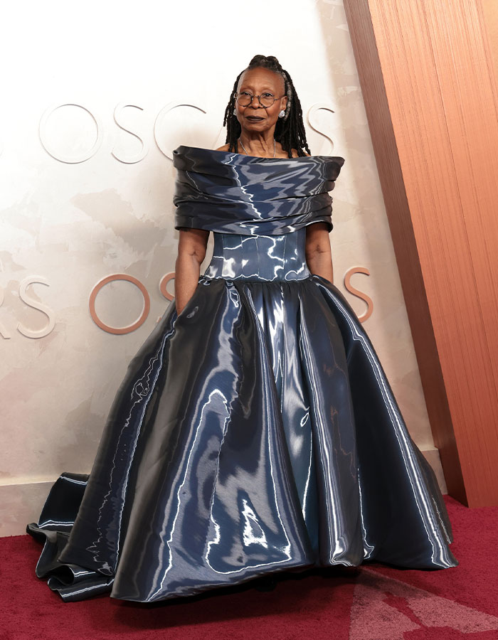 Person in a shiny, unconventional gown at the Oscars 2025, reflecting one of the fashionably challenged looks.