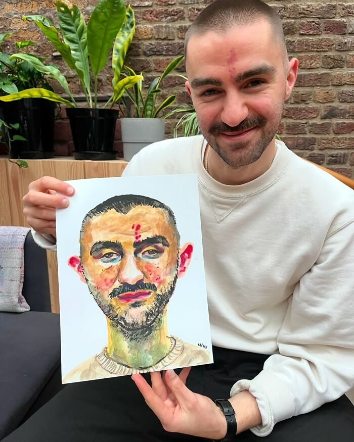 British artist showing a colorful and expressive portrait in a cozy room with plants.