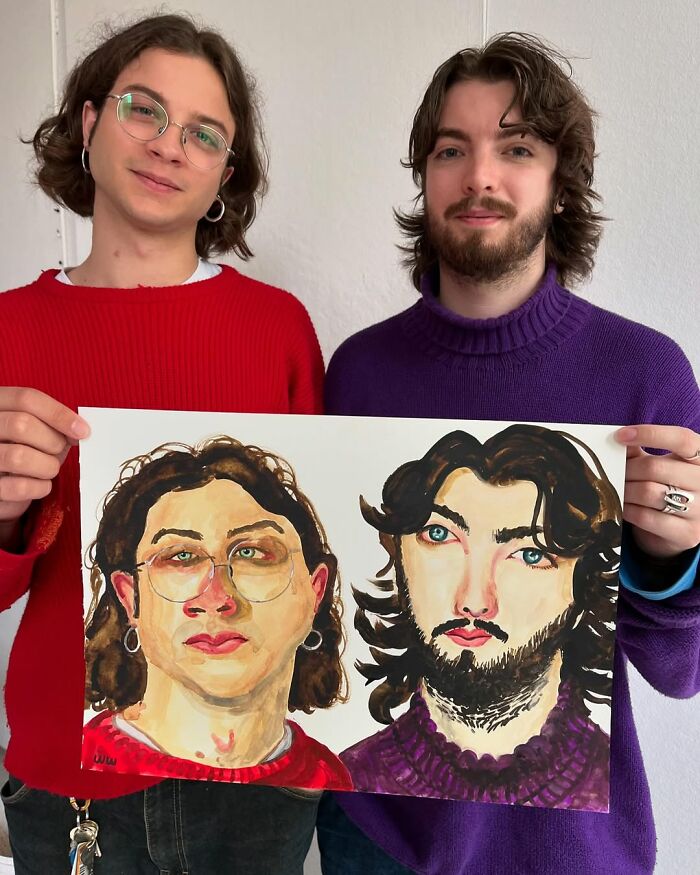 British artist holding colorful expressive portraits inspired by his unique style.