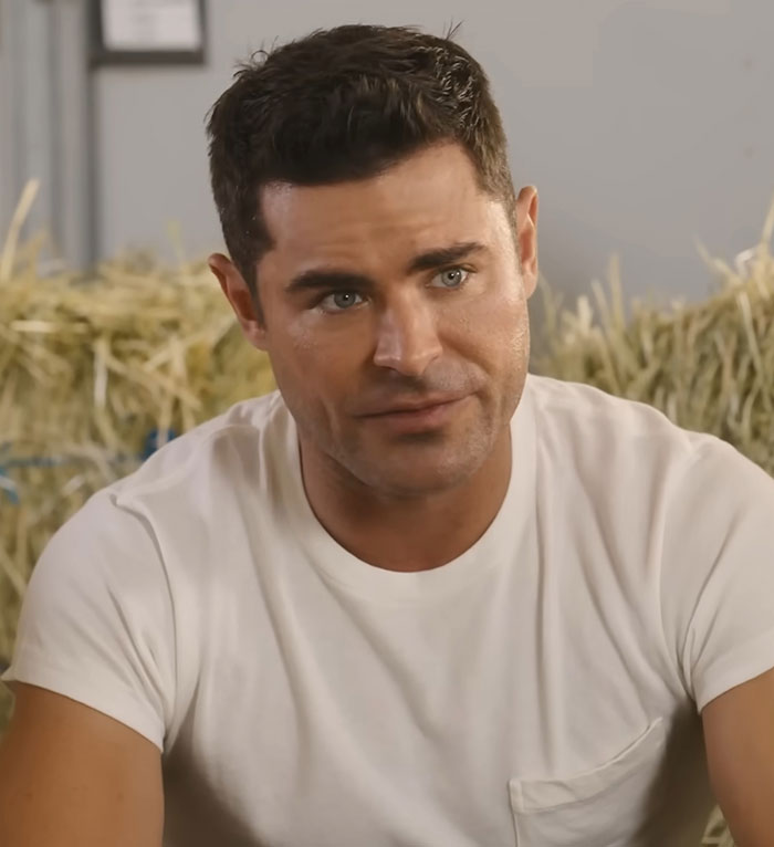 Richard Wilkins' son in conversation, wearing a white T-shirt, showcasing a significant transformation.