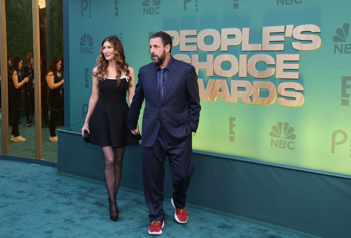 Adam Sandler at the People's Choice Awards, dressed formally, showcasing comedy success.