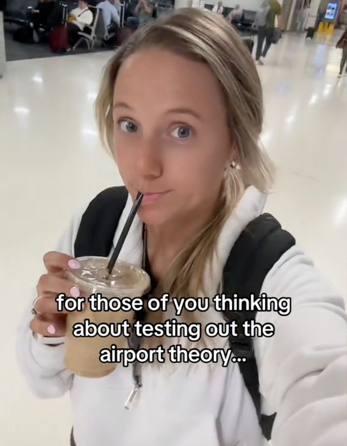 Person sipping iced coffee with text overlay about airport theory in a busy terminal. Person sipping iced coffee with text overlay about airport theory in a busy terminal.