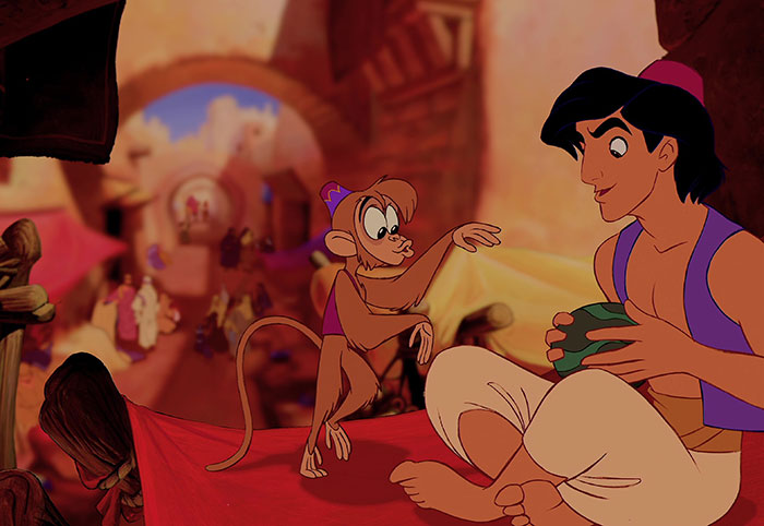 Cartoon characters from Disney's Aladdin in a vibrant market scene.