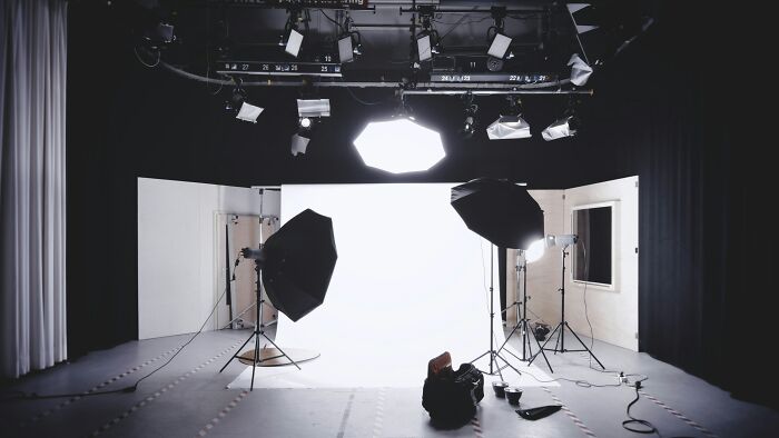 Photography studio setup with lighting equipment, reflecting the common misconceptions about photographers' jobs.