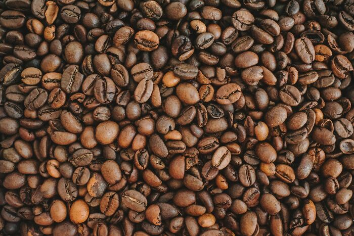 Coffee beans representing a lifetime supply for winners, highlighting abundance and texture.