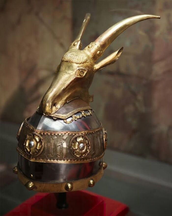 Golden goat-headed helmet artifact from ancient civilizations, showcasing intricate craftsmanship and historical significance.