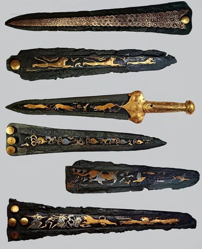 Ancient daggers featuring intricate gold inlays and carvings, showcasing craftsmanship from thousands of years ago.