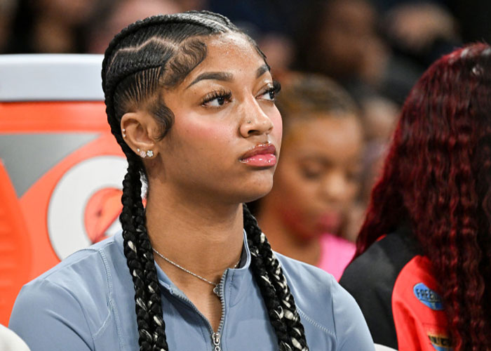 Angel Reese with braided hair sitting, sparking net worth debate.