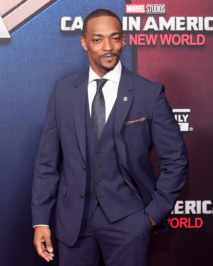 Anthony Mackie in a suit at "Captain America" event.