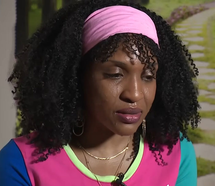 Close-up of a woman looking down, representing a runaway girl found after a year.