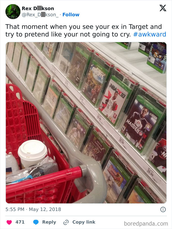 Shopping cart at Target near video games, capturing an awkward life moment.