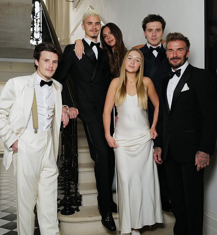 David Beckham with family at an elegant event, sparking fury with ex-assistant's bombshell affair interview.