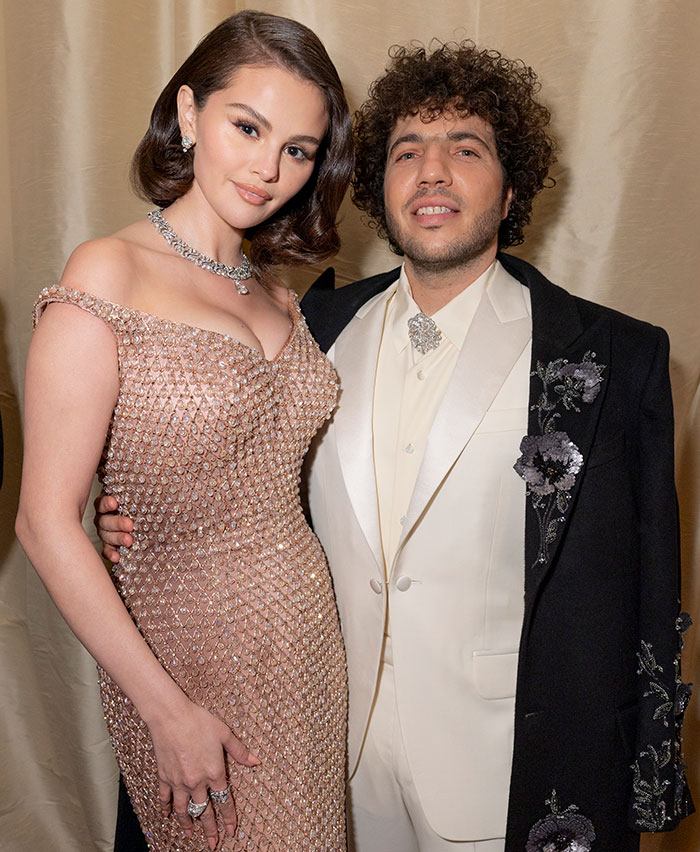 Person posing with Benny Blanco after eyebrow transformation, both in formal attire at an event. Person posing with Benny Blanco after eyebrow transformation, both in formal attire at an event.