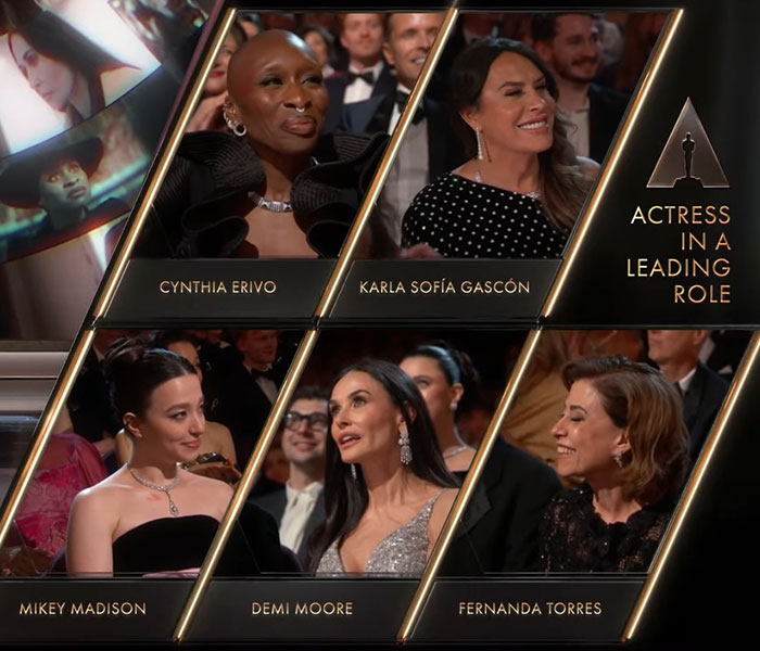 Demi Moore at the Oscars, surrounded by fellow nominees for Actress in a Leading Role.