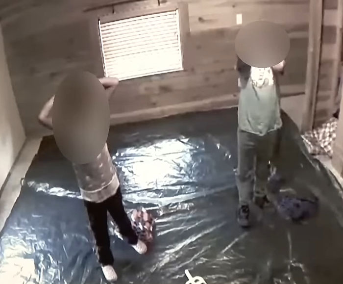 Children in a room with blurred faces, standing on a tarp. Children in a room with blurred faces, standing on a tarp.