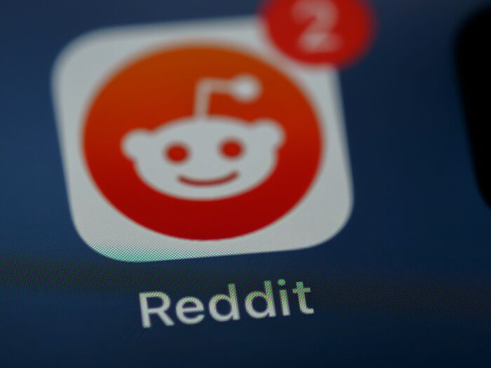 Reddit app icon with notification, a platform where users discuss wild theories.