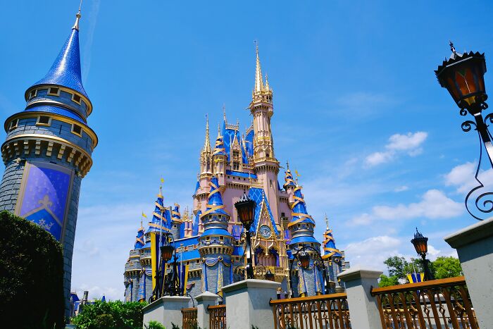 Iconic castle under a clear blue sky, representing touristy places often said to be overrated by seasoned travelers.
