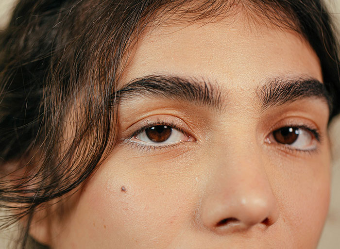 Close-up of a bridesmaid's face, showcasing her natural features. Close-up of a bridesmaid's face, showcasing her natural features.