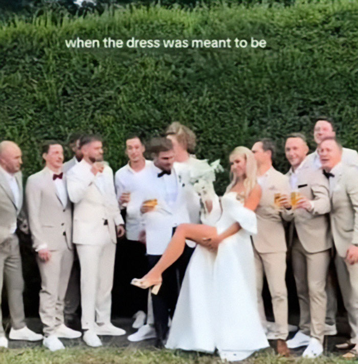 Bride playfully flashes underwear during wedding photoshoot with the groomsmen.
