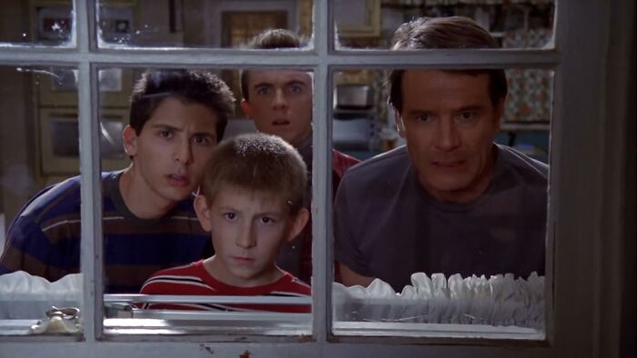 A group of people peering through a window, related to celebs who disappeared from media.