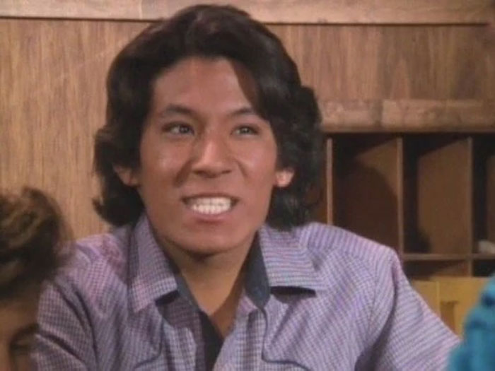 Person smiling indoors, related to celebrities disappearing from media discussions.