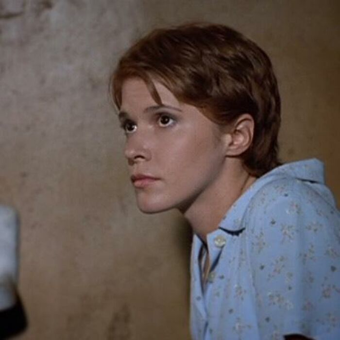 Young person in a patterned shirt looking sideways, representing celebs who disappeared from media attention.