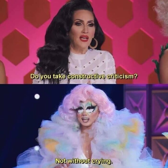 TV show scene with a woman asking about criticism and another in drag responding humorously. Cheerful Nihilism meme.