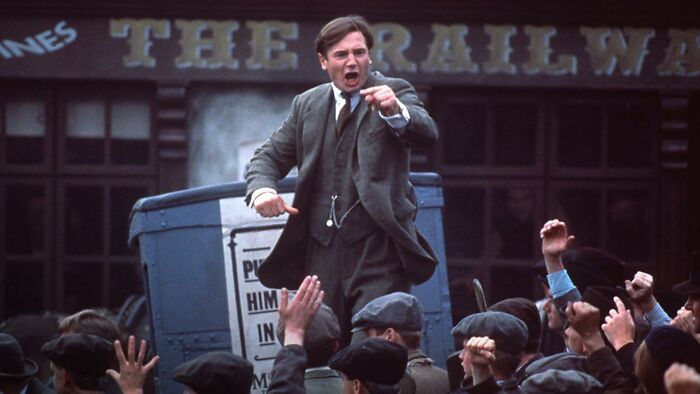 Man passionately speaking to a crowd, illustrating a historical event related to Napoleon returning from exile.
