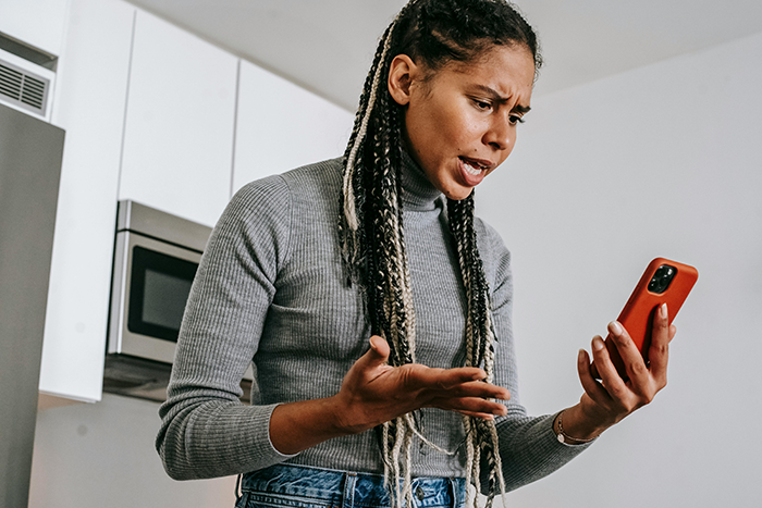 Woman arguing on phone, upset about kid's college fund issue. Woman arguing on phone, upset about kid's college fund issue.