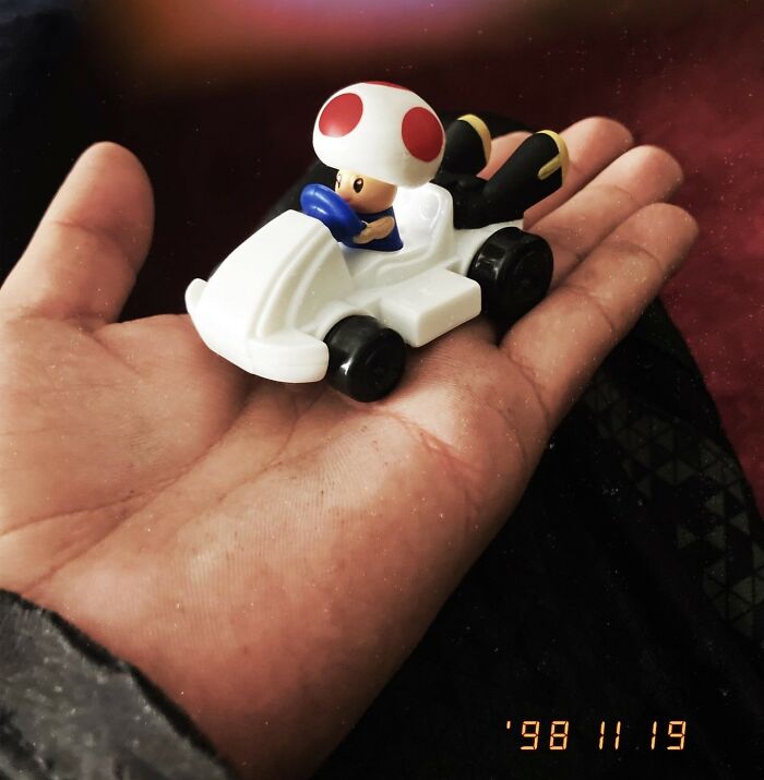 Toy kart held in hand, illustrating tales of infuriating moments shared online.