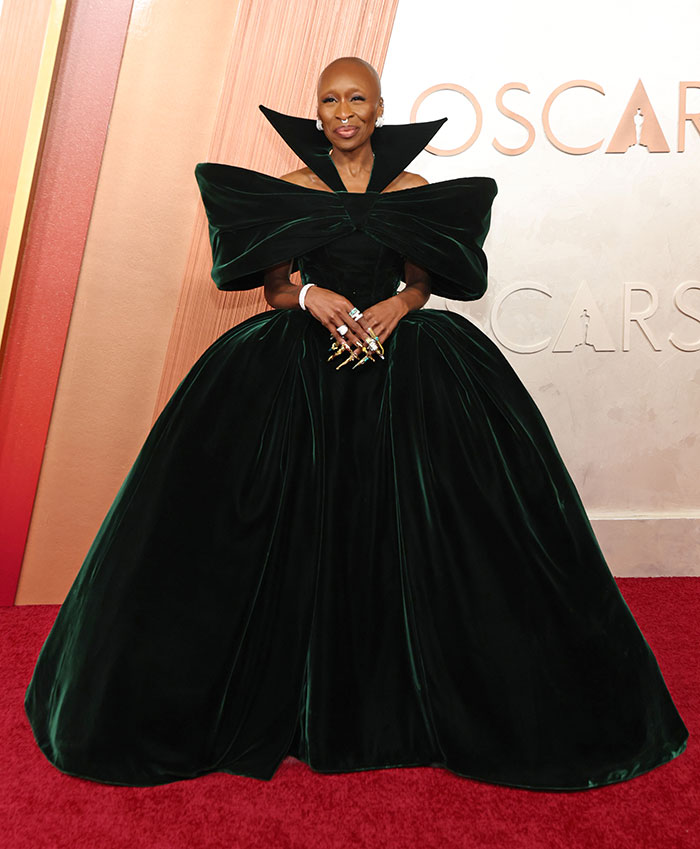 "Celebrity in elegant green gown on Oscars red carpet."