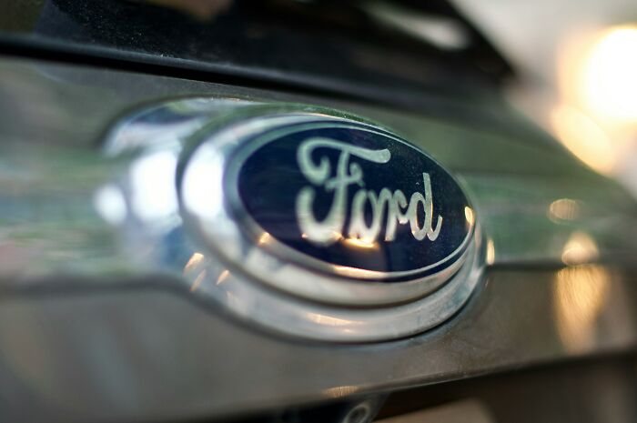 Ford logo on a vehicle, close-up with a shiny metallic finish.