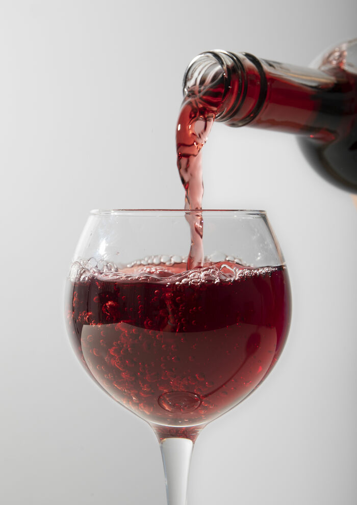 Red wine being poured into a glass, highlighting misunderstood 'healthy' choices.