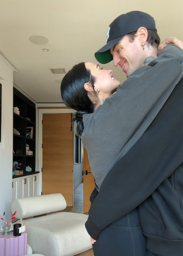 Couple embraces in cozy room, highlighting Ozempic weight loss transformation.