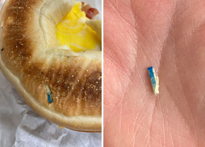 Bagel with egg and blue shard found inside, illustrating a food discovery gone wrong.