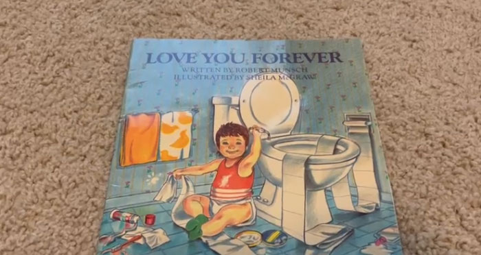 Children's book "Love You Forever" cover, showing a smiling child near a toilet.