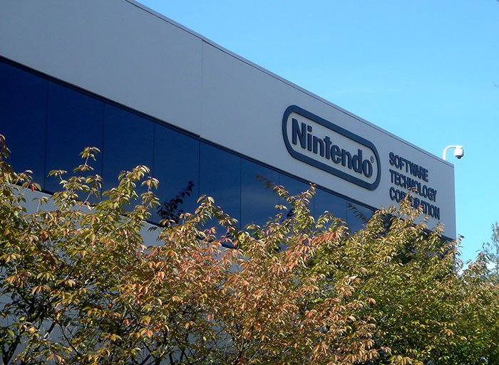Nintendo headquarters building with trees, depicting a wholesome facade with possible disturbing backstories.
