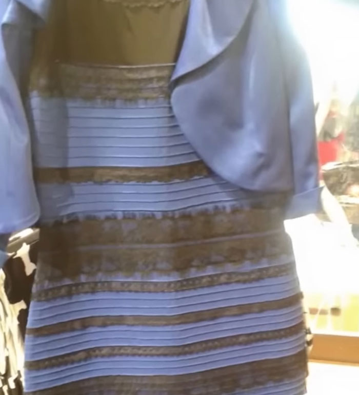 Blue and black dress with black stripes, famously known for its debate over colors, illustrating a wholesome illusion.