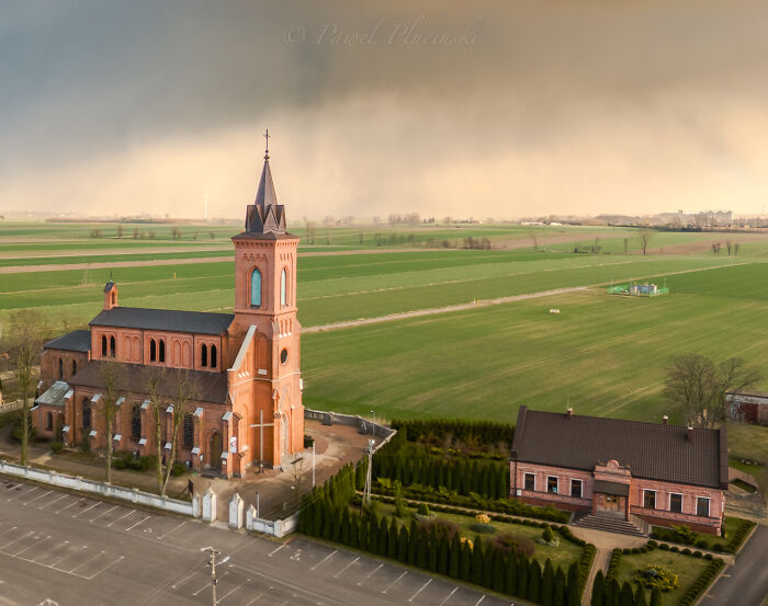 Aerial view of a church and surrounding countryside, showcasing my city seen from above.