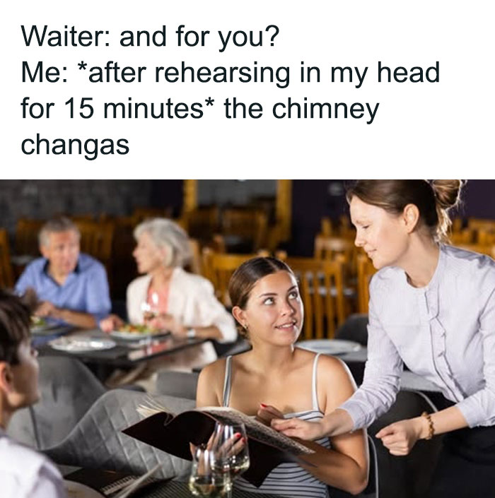 Waitress taking an order from a woman, illustrating a food-related meme scenario in a busy restaurant.