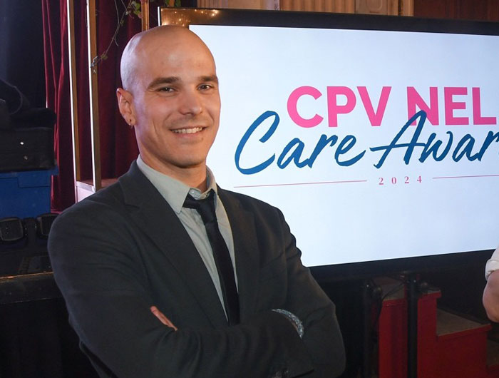Man in a suit at CPV NEL Care Awards 2024 event, standing confidently. Man in a suit at CPV NEL Care Awards 2024 event, standing confidently.