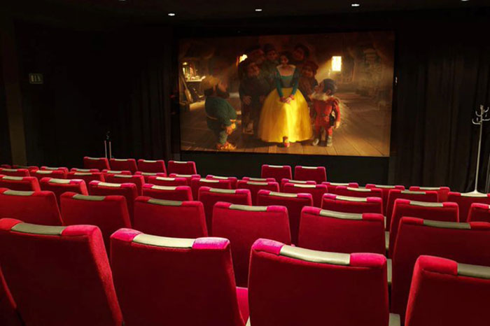 Empty theater showing Snow White during primetime, highlighting low attendance issues.