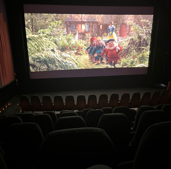 Empty theater showing 'Snow White' during a primetime slot, highlighting low attendance.