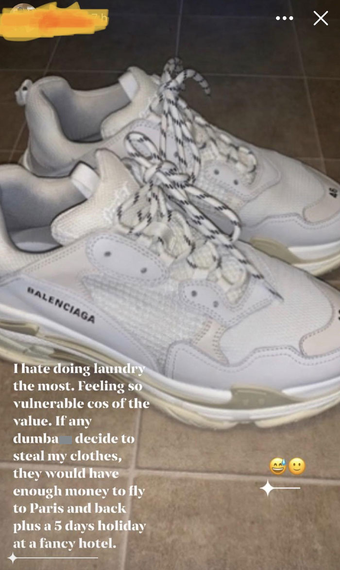 Expensive white sneakers with text shaming rich people for laundry complaints.