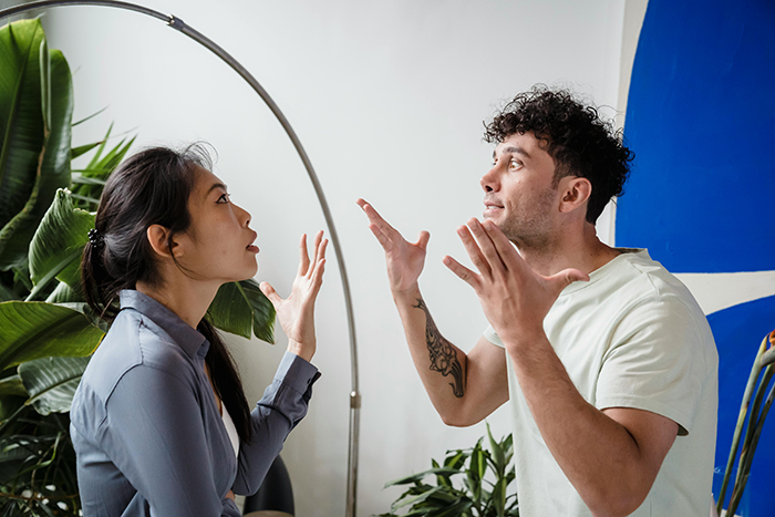 Man and woman arguing indoors near plants about real ring swap.